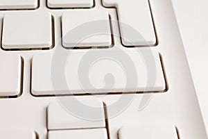 White keyboard keys of a personal computer or laptop close - up without inscriptions