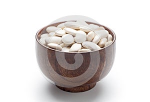 White kidney beans in a wooden bowl