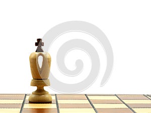 White King Chess Piece On A Chess Board With White Background