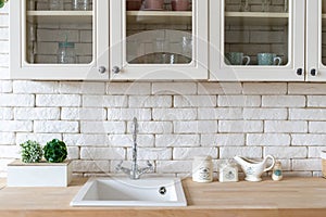 White kitchen in apartment with modern interior