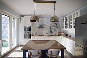 White kitchen with blue island