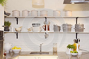 White Kitchen, Colorful Fruits on Granite Counter, Pots and Plates on Shelves