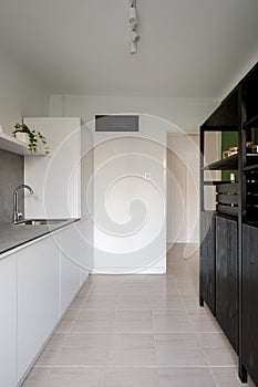 White kitchen with dark sideboard