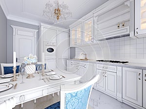 White kitchen with dining table in a classic style. The bright interior of the kitchen