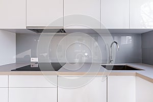 White kitchen with gray backsplash