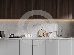 White kitchen with gray cabinets and wooden cupboards