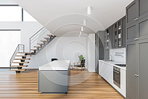 White kitchen interior with cupboards, side view