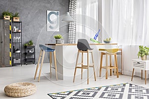 White kitchen island and barstools