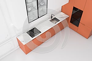 White kitchen with orange countertops, top view