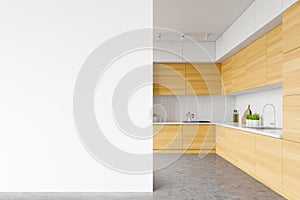 White kitchen, wooden countertops and mock up wall