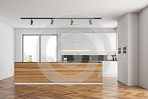 White kitchen with wooden island