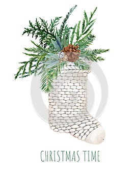 White knitted christmas sock with lush spruce bouquet