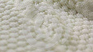 White knitted wool texture. use as background. close-up