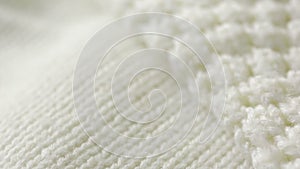 White knitted wool texture. use as background. close-up