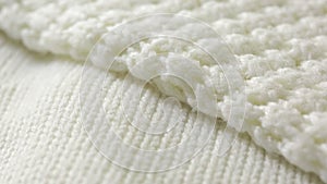 White knitted wool texture. use as background. close-up