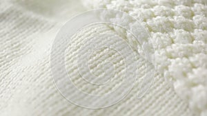 White knitted wool texture. use as background. close-up