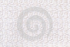 White knitted woolen background with pattern of soft, fleecy cloth. Texture of textile closeup.