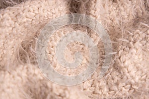 White knitwear texture. Soft texture of homemade cashmere wool sweater.