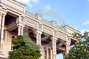 White Kokhi Navruz Palace facade exterior architecture with columns and archs decorations