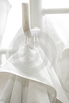 White lab dressings gown on a hanger