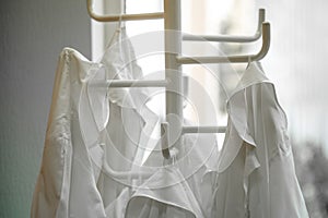 White lab dressings gown on a hanger