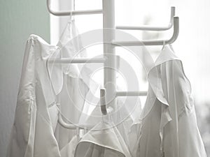 White lab dressings gown on a hanger