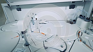 White laboratory device while taking clinical tests. Coronavirus, covid-19 laboratory test.