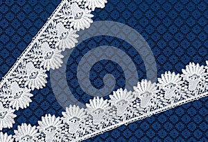 White lace on background blue guipure