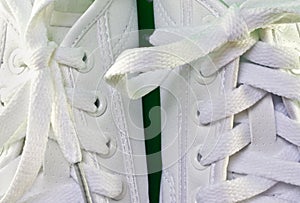 White laces in tennis shoes.