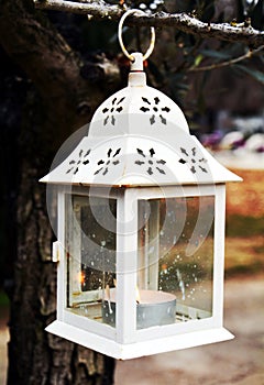 White lamp candle, as decoration in cemetery photo
