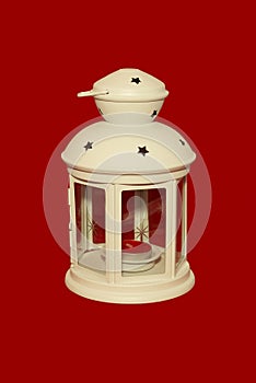 White lamp with a red candle