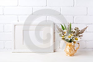 White landscape frame mockup with chamomile and grass in golden