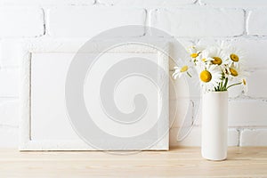 White landscape frame mockup with daisy flower in styled vase