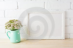 White landscape frame mockup with soft pink flowers in pitcher