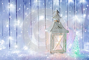 White lantern with Christmas ornaments