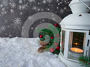 White lantern glowing on a snowy christmas night.