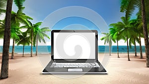 White laptop screen on the sandy tropical beach