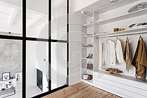 White and large wardrobe closet in dressing room