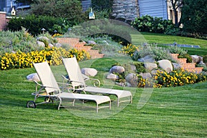 White Lawn Chairs Landscaped Yard photo