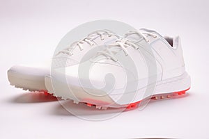 White leather boots with spikes on sole closeup