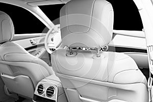 White leather interior of the luxury modern car. Leather comfortable white seats and multimedia. Steering wheel and dashboard. Aut