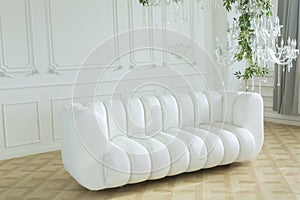 White leather sofa in a bright room against a white wall