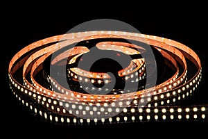 White LED strip on reel with black background photo