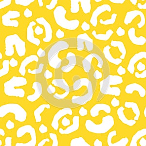 White leopard spots on yellow seamless pattern