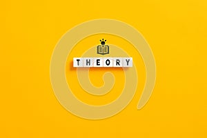 White letter blocks on yellow background with the word theory. Theoretical knowledge, principles and ideas in education concept