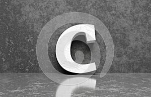 White letter C on concrete wall an floor background