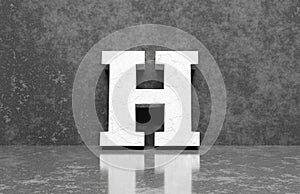 White letter H on concrete wall an floor background