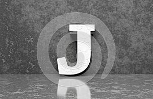 White letter J on concrete wall an floor background