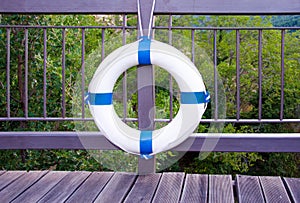 White life buoy hanging from the balcony