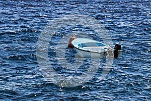 White and light blue boat in the sea